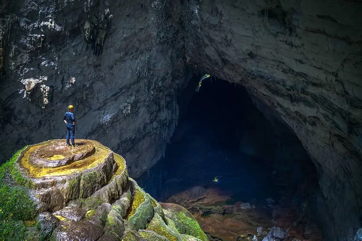 Explorers trekking inside Vietnam Hang Son Doong Cave during an Oxalis Adventure expedition experience.