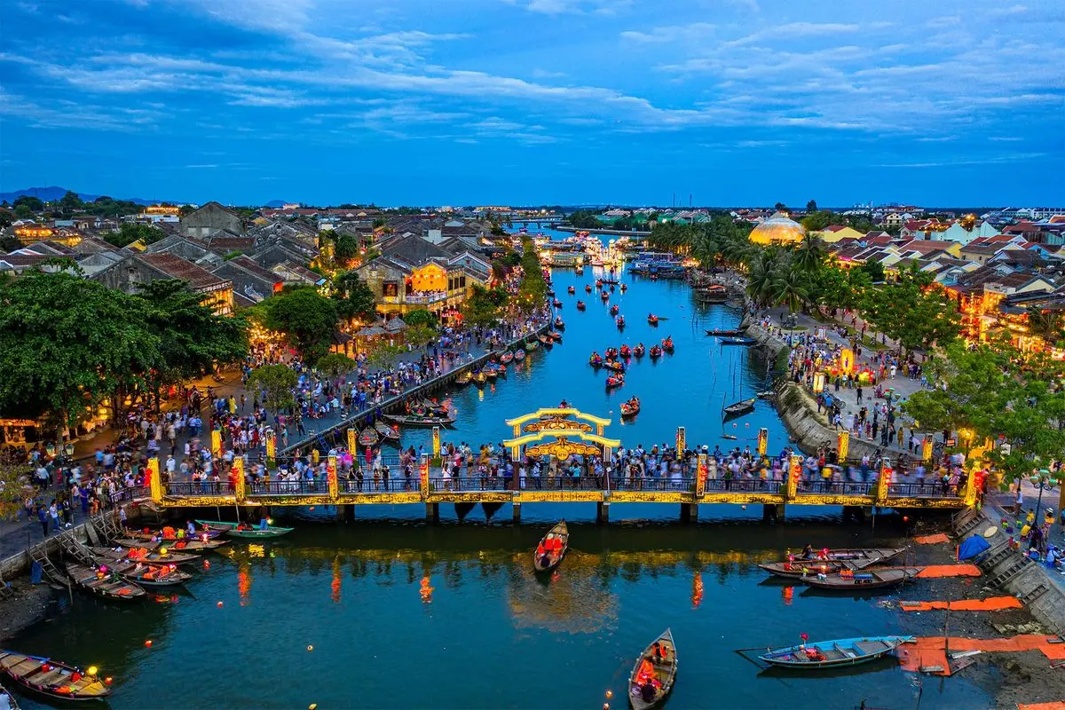 Glowing lanterns illuminate a historic street in Hoi An Ancient Town, a key travel destination in Central Vietnam.