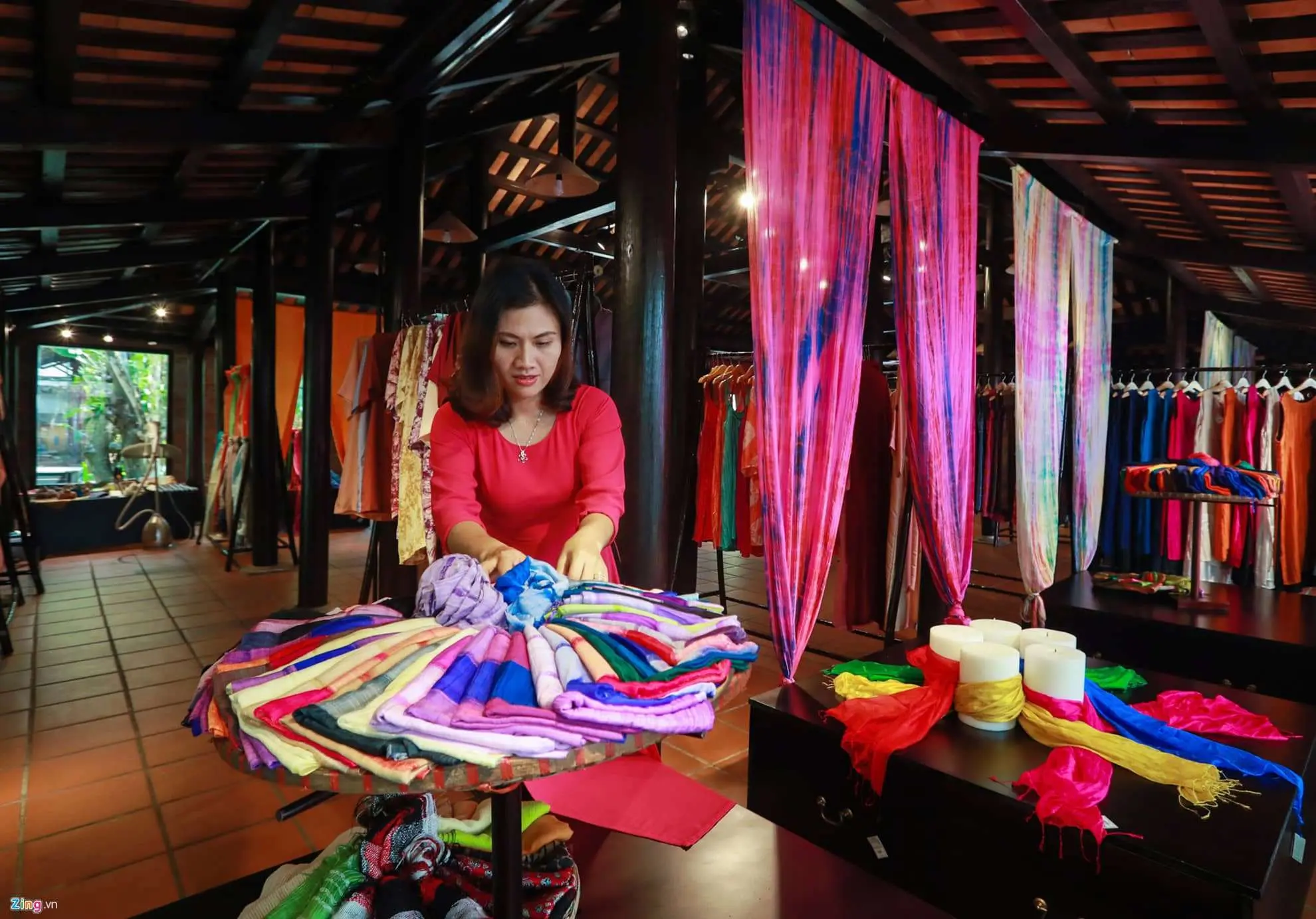 Interior of a tailor shop filled with colorful fabrics in Hoi An Vietnam.