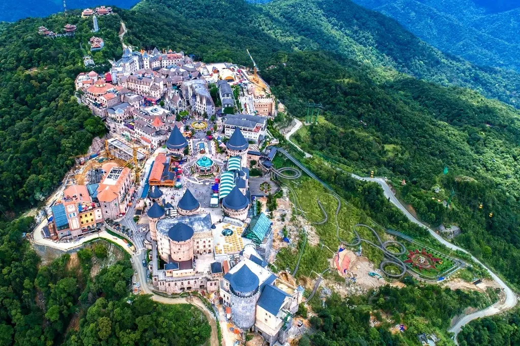 Panoramic view of the entire Sun World mountain resort complex including the Golden Bridge at Ba Na Hills Vietnam.