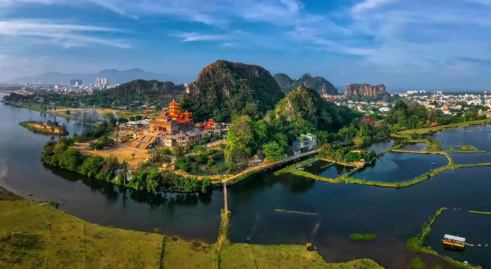 Panoramic vista of the five limestone hills making up Marble Mountain Vietnam near Da Nang.