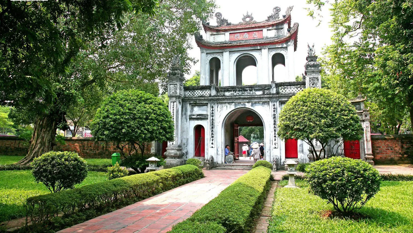 The tranquil courtyard of the Temple of Literature (Van Mieu) in Hanoi, showcasing traditional architecture and ancient steles, reflecting the deep history of Vietnam's capital.
