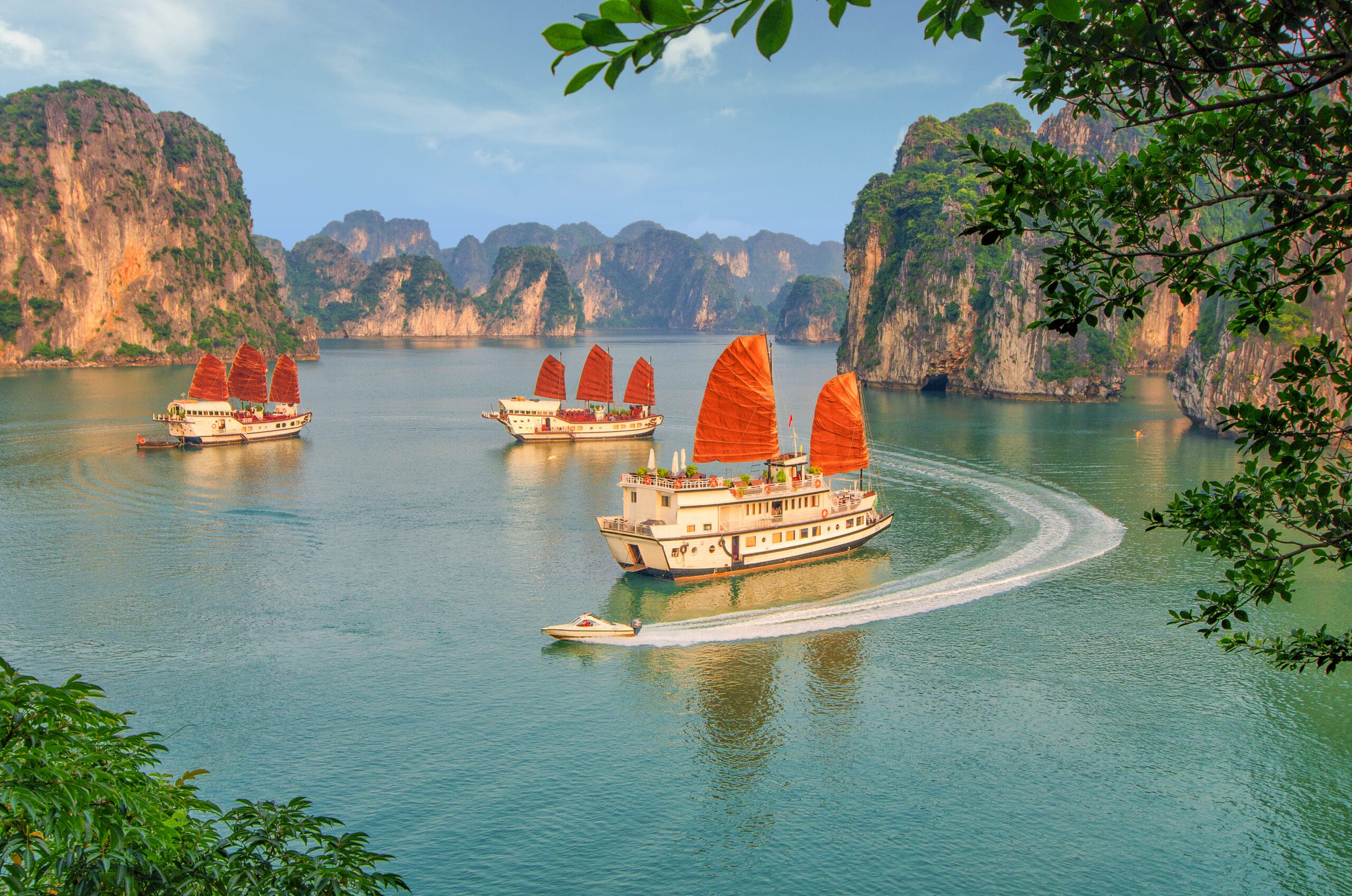 Majestic panoramic landscape of Ha Long Bay at sunset, highlighting its UNESCO World Heritage natural beauty.