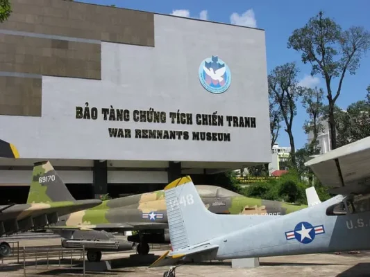 Exterior of the War Remnants Museum in Vietnam, displaying US military aircraft